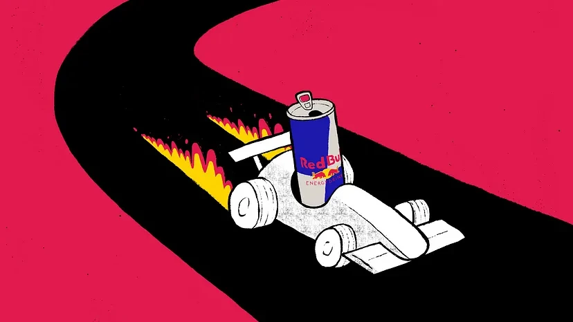 Red Bull can on a race car speeding on a track.
