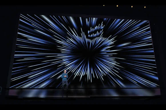 Apple event stage with dynamic light display.
