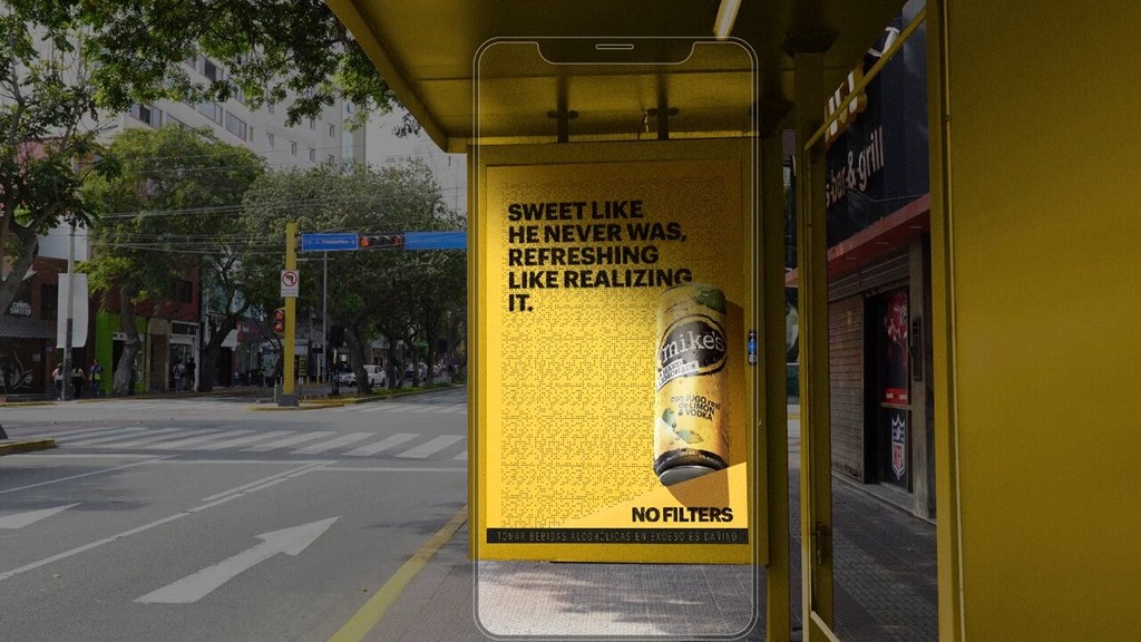 Bus stop ad for Mike's Hard Lemonade with bold text and can image.